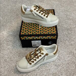 Kurt Geiger Gold and Cream Sneakers 
NEW IN BOX!! 🇺🇸Size 7.5, EUR 38 
Reg. $150+